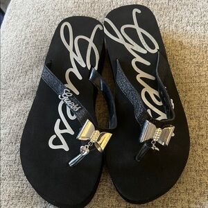 Guess Black flip flop Sandals with Silver Bow Accents